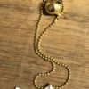 Collana "Paper boat” barchetta di carta con sonaglio oro - immagine 2